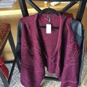 Sweater with leather sleeve