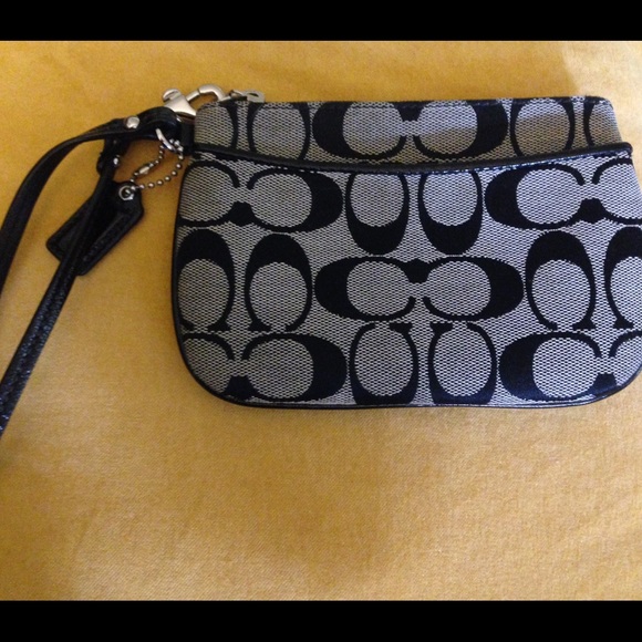 Gray/black Coach signature wristlet