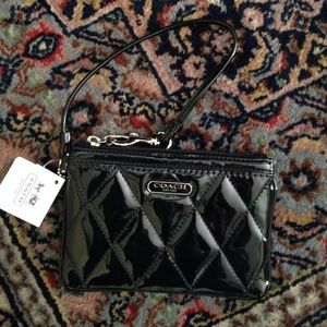 Coach patton leather wristlet.  New with tags.