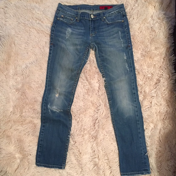 Distressed Medium Wash Straight Leg Jean.