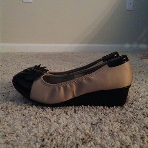 Beige and black leather wedges