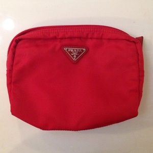 Small red Prada bag.