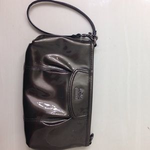 Small gray Coach wristlet.