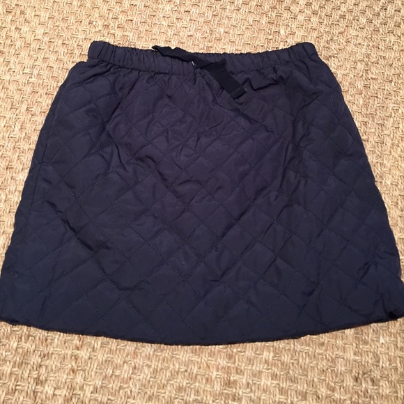 Navy quilted skirt.