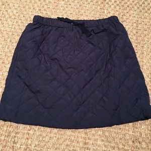Navy quilted skirt.