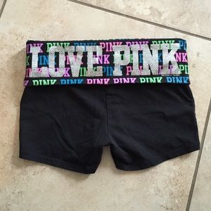 Pink VS yoga shorts.