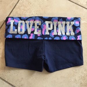 Pink VS yoga shorts.