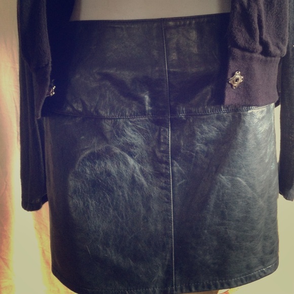 Black leather miniskirt with silver zipper.
