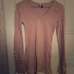 Free People long-sleeved v-neck with lace-up cuffs