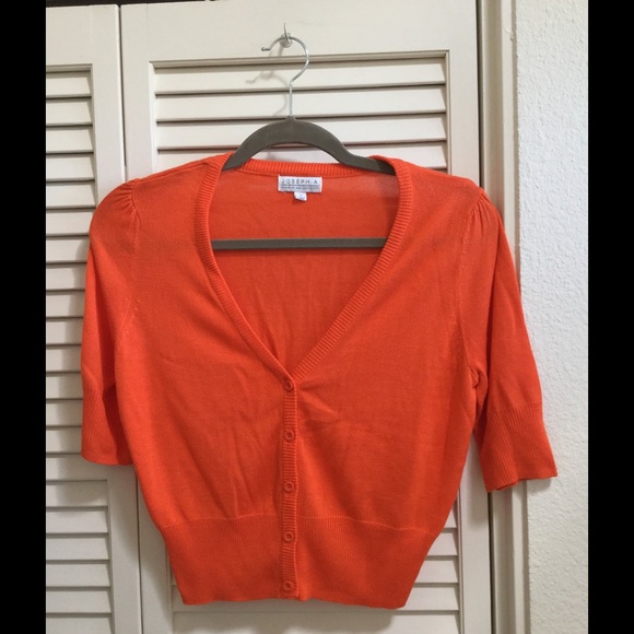 Orange half sleeve cardigan.