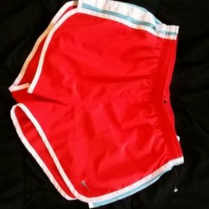 Red and blue nike running shorts