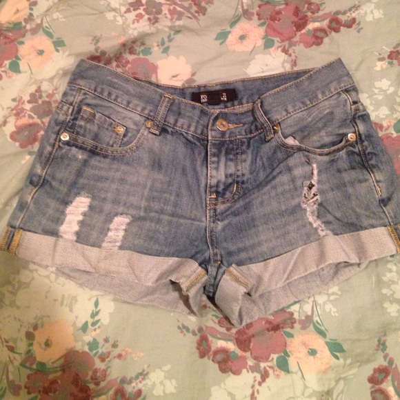 Dark wash, ripped shorts.