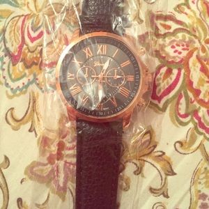 Black and rose golden watch
