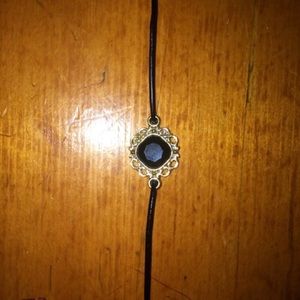 black gem choker on black cord