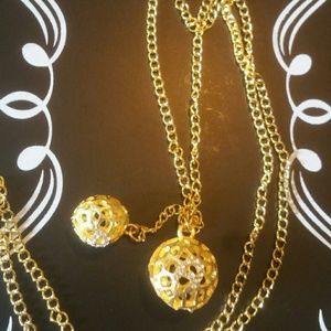 2 golden balls that dangle necklace