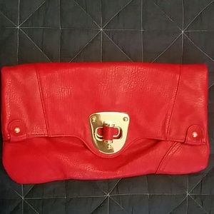Oversize red clutch used once