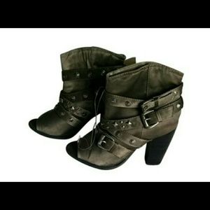 Green satiny booties by Qupid