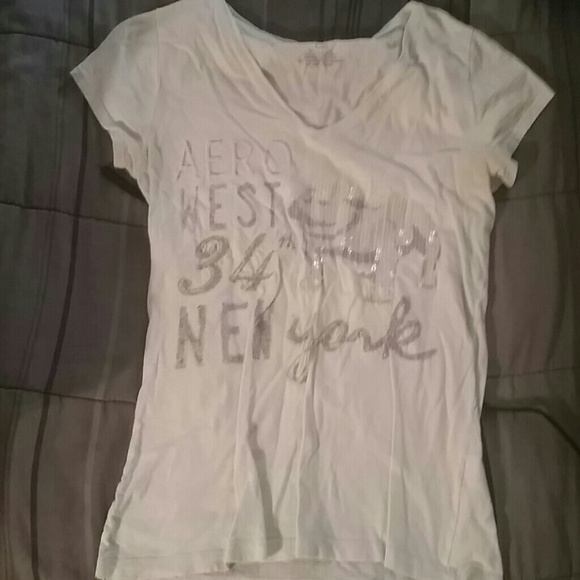 A very light green/blue tshirt.