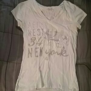 A very light green/blue tshirt.