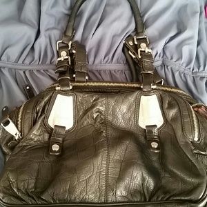 B . makowsky black leather handbag
