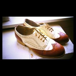 Cream and brown wingtip shoes