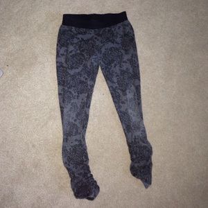 Zara Grey leggings with black print on them