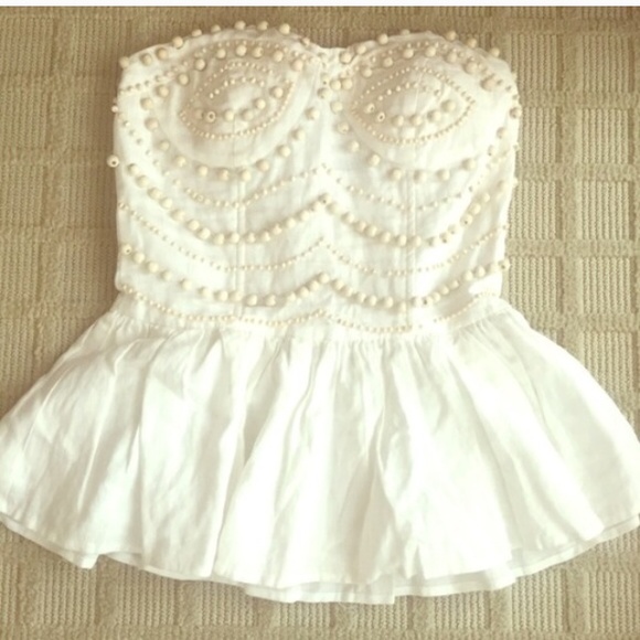 Peplum beaded ivory top