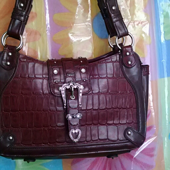 M.C. beautiful crafted maroon leather handbag