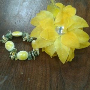Yellow hair piece and bracelet
