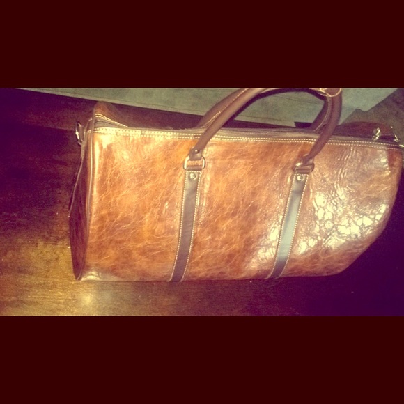 Brown leather duffle bag.