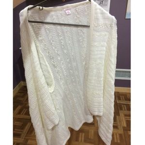 a whitish/cream colored cardigan