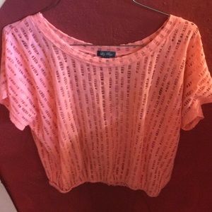 Bright pink see through top.