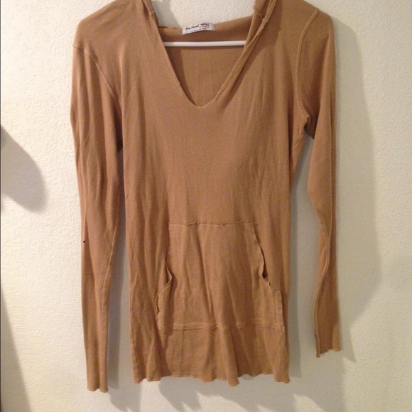 Soft long sleeve with hood and pocket.