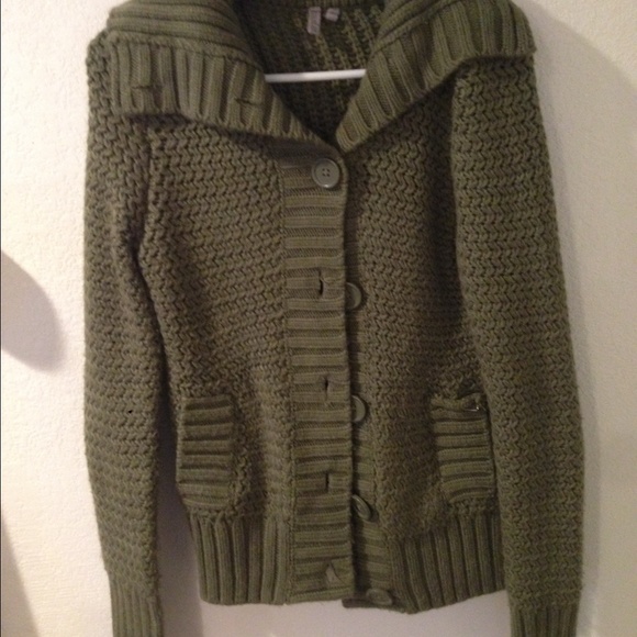 Knitted green sweater.