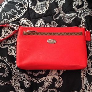 Orange Coach Signature Wristlet