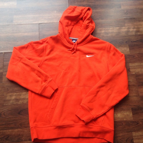 Brand new orange Nike shirt.