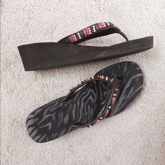 Brown, coral flip flops