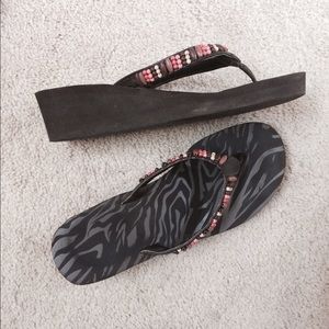 Brown, coral flip flops