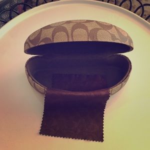 Coach case with cleaning cloth