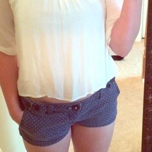 Blue American eagle shorts w/ white polka dots.