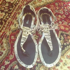 Leather animal print sandals.