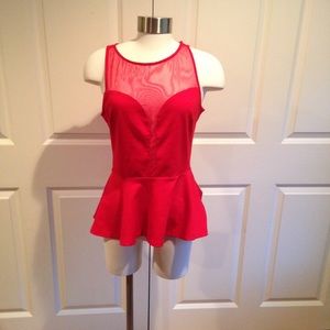 Flirty red peplum top w/sheer panel down the front