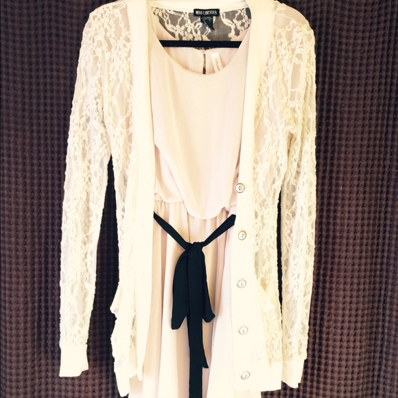 Sweet and elegant cream dress .