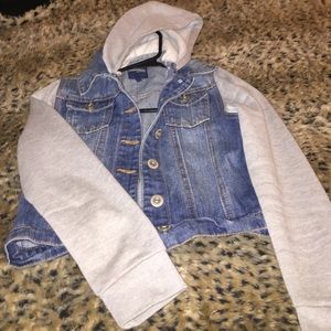 Cropped denim jacket with grey hoodie and sleeves