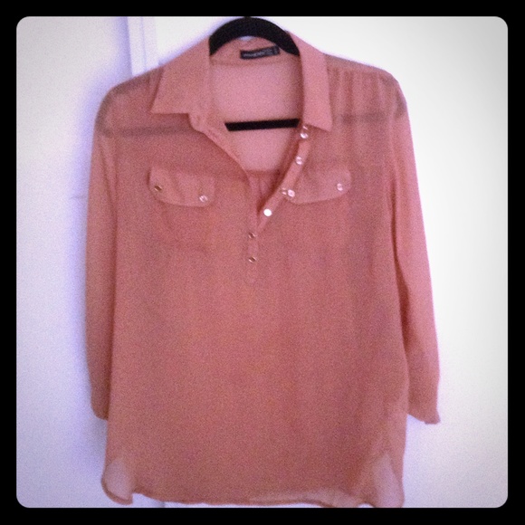 Sheer salmon colored shirt with gold accent