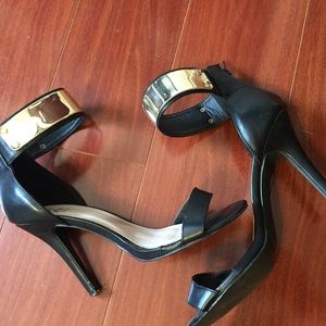 Simple black heels with gold cuff