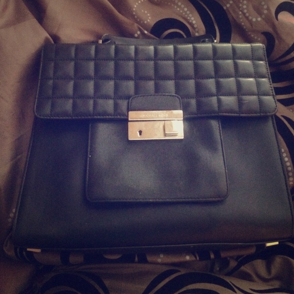 Black Michael kors bag , a few stains in side