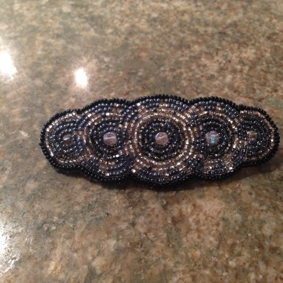 Beaded silver and blue barrette. Leather backing