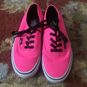 Hot pink vans with black laces.