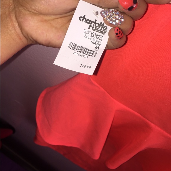 A orange pinkish dress. - Picture 3 of 4